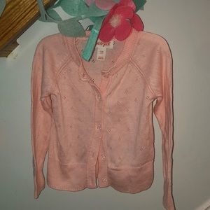 Pink jeweled cardigan.